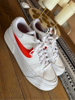 Nike White Low-Top Sneakers with Red Swoosh